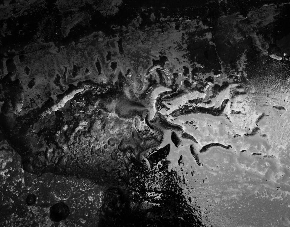 Black and white sandy terrain.
